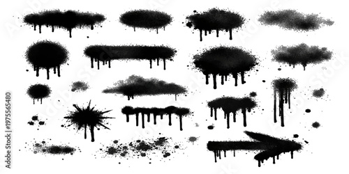 Set of black ink splashes and blots forming tropical tree silhouettes in a grunge nature design illustration