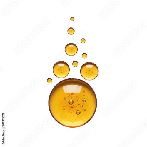 Golden liquid droplets and spheres with internal bubbles, isolated on black background
