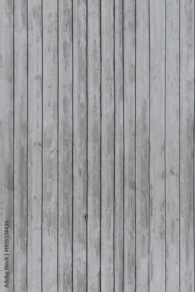 Obraz premium Old wooden wall with vertical planks in outdoor setting