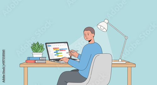 Relaxed man working on laptop at a home office desk with a lamp and plant in bright studio.