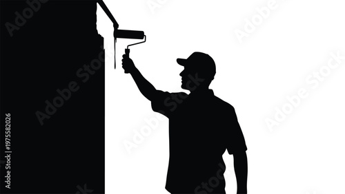 Construction worker silhouette using a paint roller to apply paint on a wall for home renovation