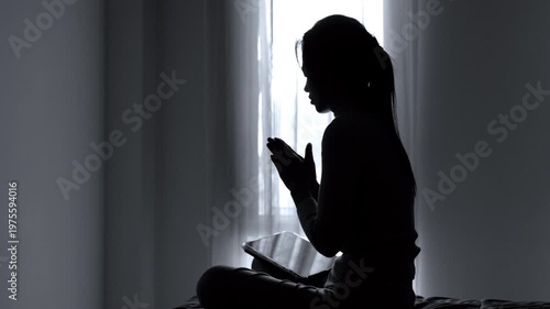 Silhouette of a woman Praying hands with faith in religion and belief in God. Power of hope or love and devotion. Namaste or Namaskar hands gesture. Prayer position.  4K slow-motion video.
