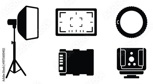 Photography studio equipment and camera accessories collection featuring essential tools like softbox, viewfinder, ring light, battery pack, and flash for various media projects.