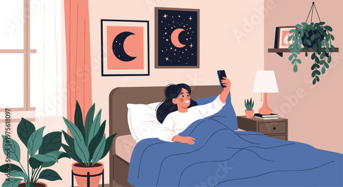 Cozy bedroom scene with a young woman sitting in bed under a blue blanket taking a selfie with her smartphone.