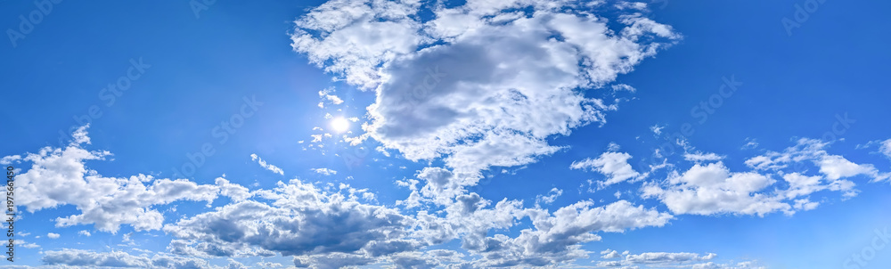 Obraz premium Wide detailed panorama of the sky with a large number of clouds. Spacious summer clear space with cloud flying towards the wind. Uniform filling with white spots of diagonal movement