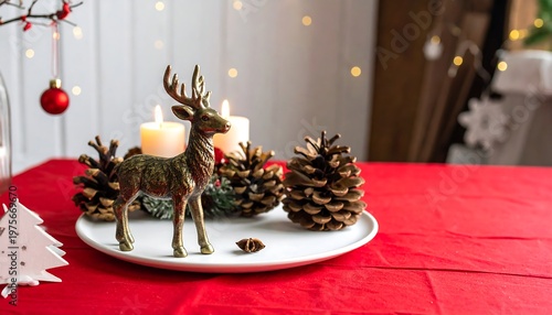 A festive holiday table setting with a reindeer centerpiece and pinecones