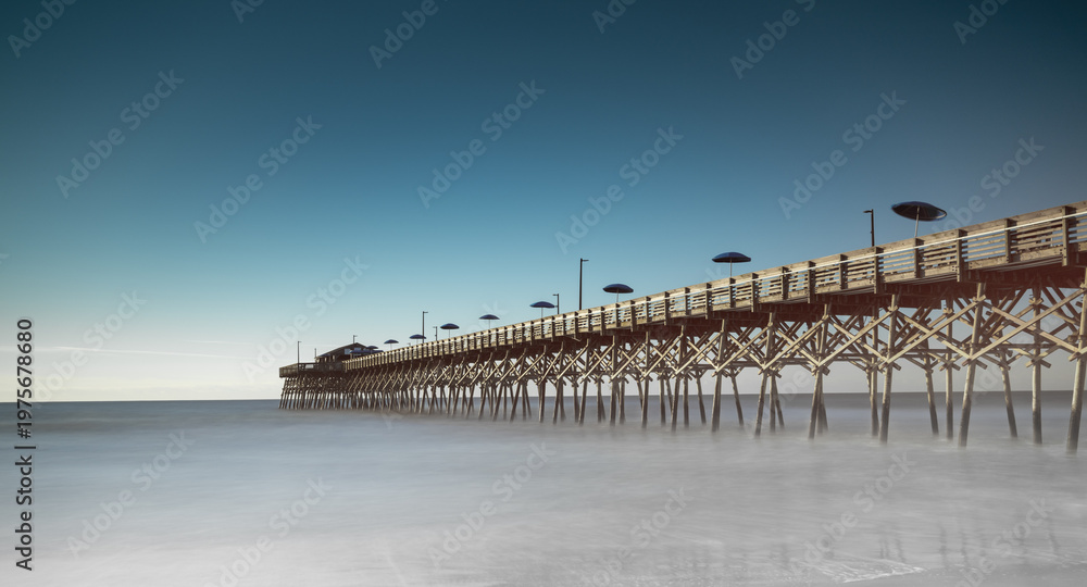 Fototapeta premium panorama long exposure of the Garden City Beach Pier in South Carolina