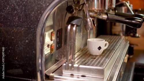 Professional coffee Machine Dispenser. Barista Makes Coffee In The Coffee Machine. White Coffee Mugs. Close Up.