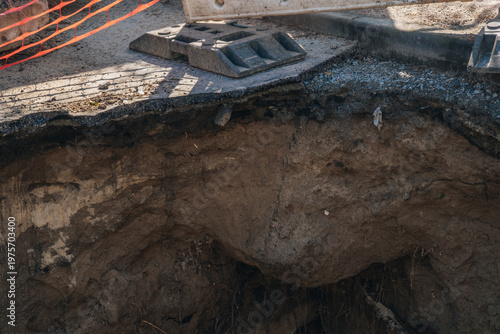 Quadro em tela Close-up of asphalt road collapse and soil layers in an excavation pit