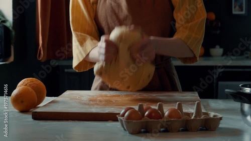 Woman in apron mixing raisin dough for Easter bread in home kitchen
