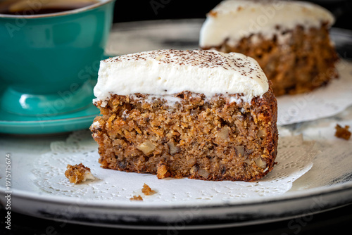 Photos Carrot cake with almond flour and walnuts, topped with whipped cream
