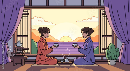 Two women sitting on floor drinking tea.