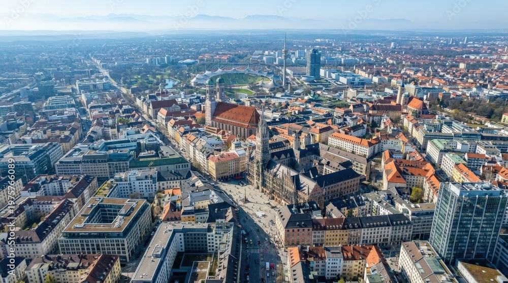Obraz premium Aerial view of Munich, Germany, broad city grid with historic center and modern districts under clear daylight, subtle haze on the horizon, photorealistic urban drone photography, high detail, 8K,no