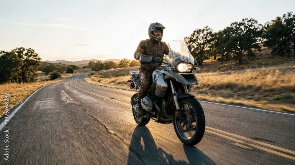 Fototapeta premium Motorcycle traveling on a quiet rural road, open countryside, subtle motion blur, sunlight on asphalt and a strong sense of solo freedom and exploration, photorealistic transport photography,