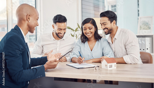 Diverse young couple signing mortgage contract with real estate agent, happy homeowners buying new house, financial advisor meeting in bright office