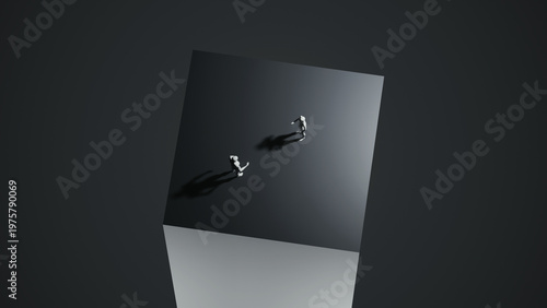 Photos Two minimalist figures walking on a dark cube, abstract composition creating a s