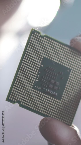 the scientist holding a chipset in the laboratory. the concept of computer, service, electronics