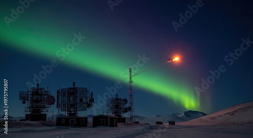 Aurora borealis over snowy landscape.