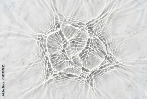 Water ripple shadows on white polished marble with deep focus