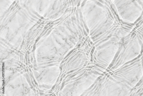 Water ripple shadows on white polished marble with deep focus