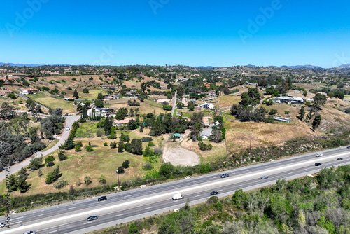 Aerial view of Fallbrook, Rainbow Crest, Rainbow Ridge with big mansion and green valley, San Diego County California