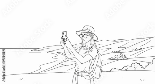 Woman in hat taking selfie on scenic hilltop with phone