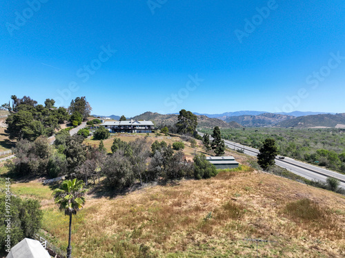 Aerial view of Fallbrook, Rainbow Crest, Rainbow Ridge with big mansion and green valley, San Diego County California