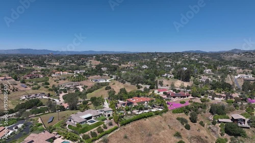 Aerial view of Fallbrook, Rainbow Crest, Rainbow Ridge with big mansion and green valley, San Diego County California