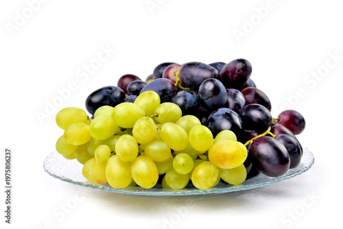 yellow and blue grapes on white plate