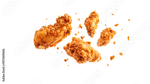 Group of fried chicken wings suspended in air