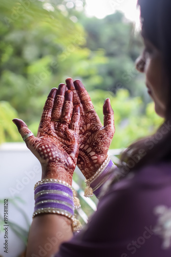 Beautiful woman dressed up as Indian tradition with henna mehndi design on her both hands to celebrate big festival of Karwa Chauth, Karwa Chauth celebrations by Indian woman for her husband