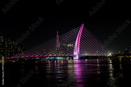 Ba Son Bridge over Saigon River with modern skyline in Ho Chi Minh City, Vietnam