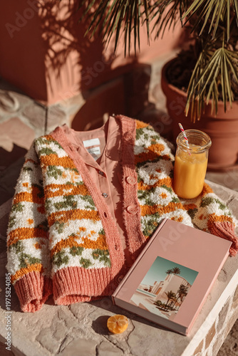Cosy autumn setup with knitted sweater, notebook, and drink — perfect for lifestyle and home decor projects.