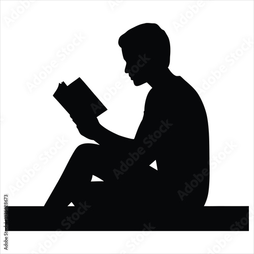 A silhouette of a person reading a book in a peaceful setting