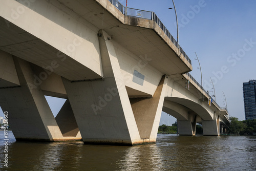 Ba Son Bridge over Saigon River with modern skyline in Ho Chi Minh City, Vietnam