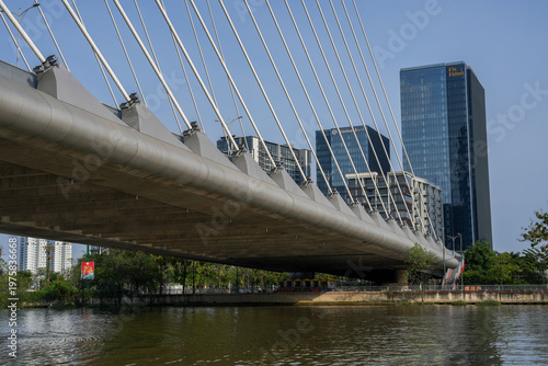 Ba Son Bridge over Saigon River with modern skyline in Ho Chi Minh City, Vietnam