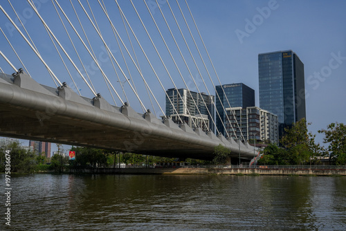 Ba Son Bridge over Saigon River with modern skyline in Ho Chi Minh City, Vietnam
