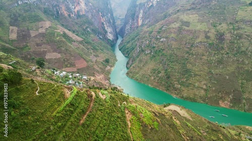 Wallpaper Mural Aerial drone footage of massive limestone cliffs rising above a narrow river carving through a deep canyon showcasing powerful geological formations and raw natural terrain Torontodigital.ca