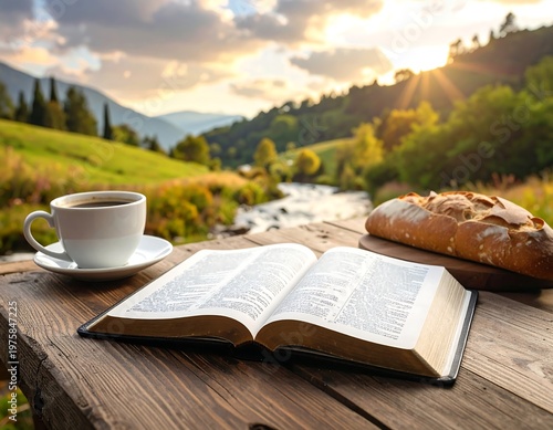 Open book, coffee, and bread on a rustic wooden table overlooking a flowing river and rolling green hills at sunrise