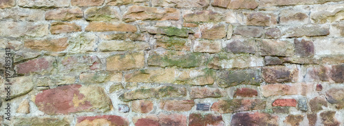 Ancient stone wall texture background with rustic masonry and weathered rocks for historic building facade and architectural garden landscape design