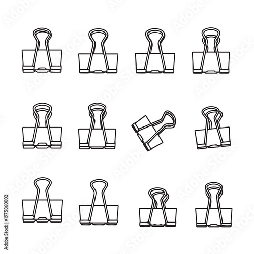 Binder clips arranged in a grid pattern with one angled on a white background