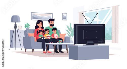 Happy family sitting on a living room sofa together while watching television and eating popcorn during a movie night.