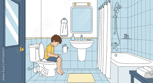 Young boy sitting on a toilet and looking at a smartphone while spending time alone in a modern blue tiled bathroom.