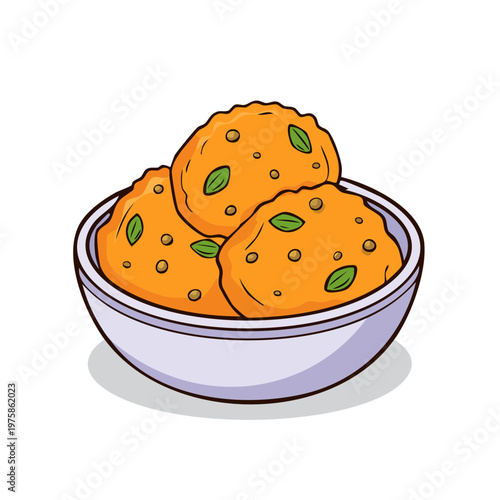 Savory Indian snacks pakora or vada in a bowl with fresh herbs and spices