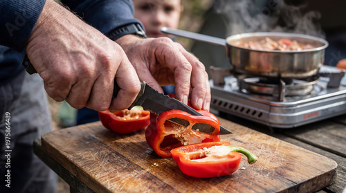 Active family recreation. Cooking a hot meal outdoors