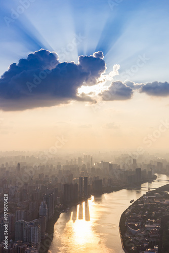 Wallpaper Mural Sun rays behind a cloud over the Pearl River at sunset in Guangzhou, China Torontodigital.ca