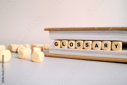 Glossary word written on a wooden block in a book