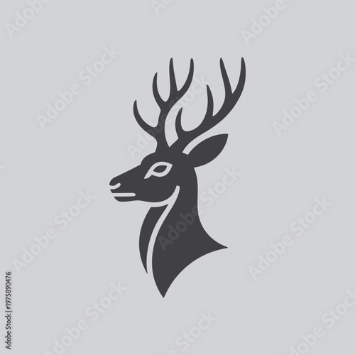 Quadro em tela Stylized deer head silhouette with antlers, side view on gray, silhouette