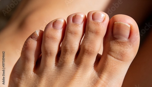 A close-up view of a person's toes with neatly trimmed toenails