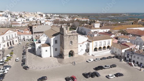 Aerial view of the Faro Cathedral and its surrounding cityscape.